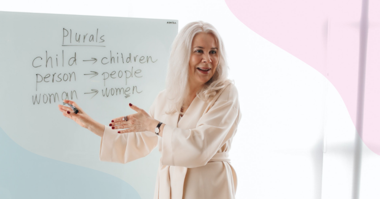 A female teacher standing at a whiteboard